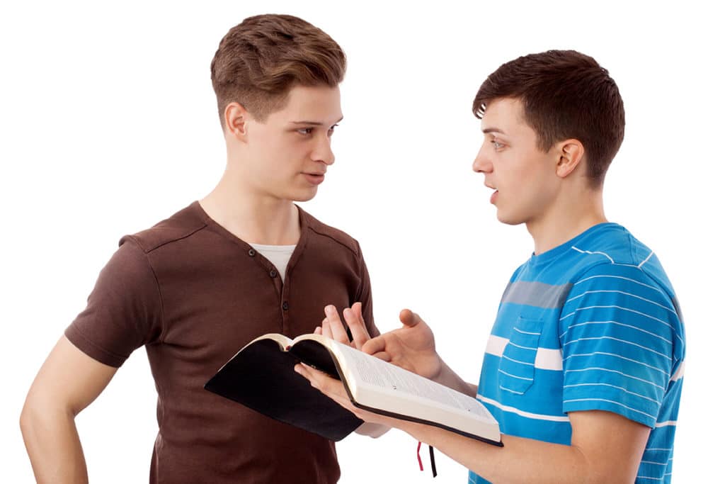 Two teen rehab boys discussing the bible