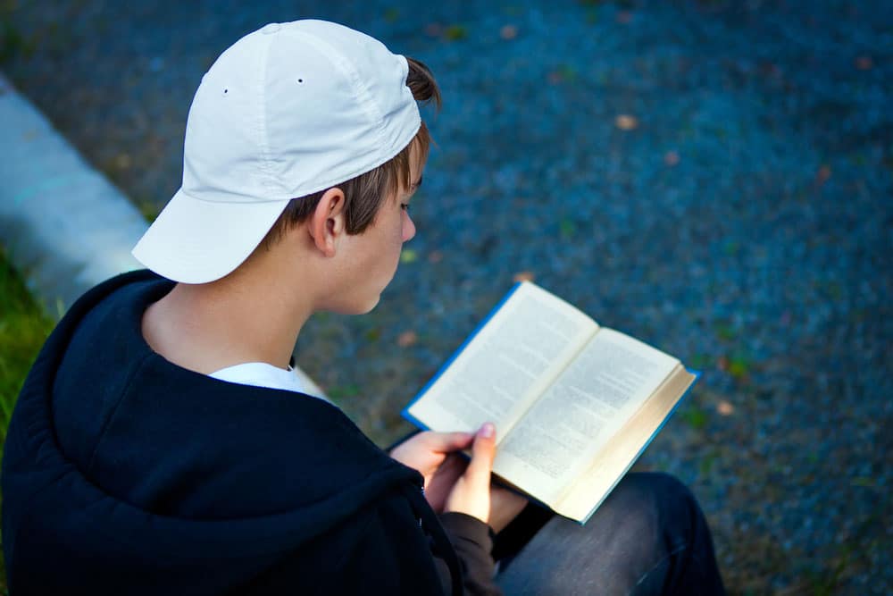 Teenager reading book